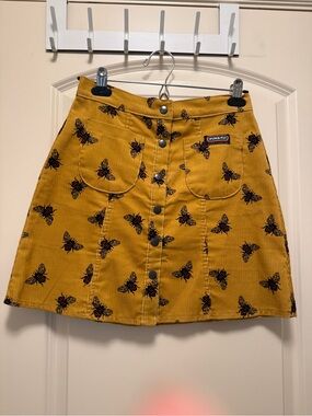 Mustard Yellow Corduroy Button-Front Skirt with Bee Print. Run & Fly.